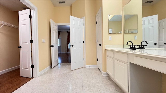 934 Westpark Dr, Celebration, FL 34747 - bathroom with vanity, a closet, and tile patterned floors
