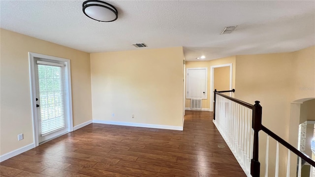 934 Westpark Dr, Celebration, FL 34747 - spare room featuring hardwood / wood-style flooring and a textured ceiling