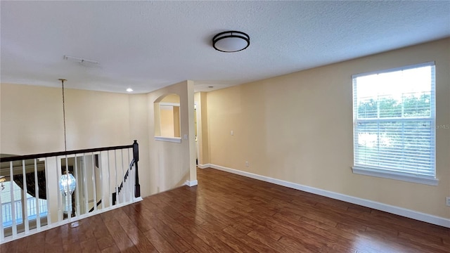 934 Westpark Dr, Celebration, FL 34747 - spare room featuring hardwood / wood-style flooring and a textured ceiling