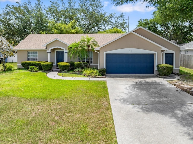 4828 Jeanette Ct, Saint Cloud, FL 34771 - single story home featuring stucco siding, an attached garage, and driveway