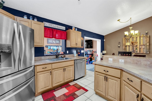 4828 Jeanette Ct, Saint Cloud, FL 34771 - kitchen featuring stainless steel appliances, light brown cabinets, a chandelier, light countertops, and light tile patterned flooring