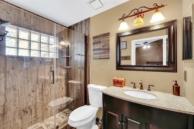 4828 Jeanette Ct, Saint Cloud, FL 34771 - bathroom featuring vanity, a stall shower, and a ceiling fan