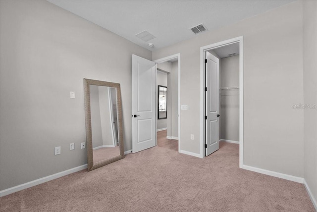1717 Hilltop Dr, Dundee, FL 33838 - unfurnished bedroom featuring carpet floors, a spacious closet, and a closet