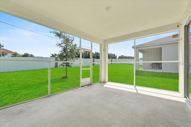 1717 Hilltop Dr, Dundee, FL 33838 - unfurnished sunroom featuring plenty of natural light and a water view