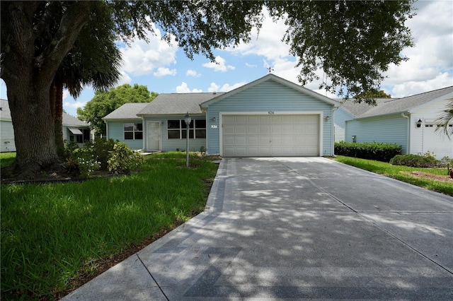 926 Chula Ct, Lady Lake, FL 32159 - ranch-style home with an attached garage, concrete driveway, and a front lawn