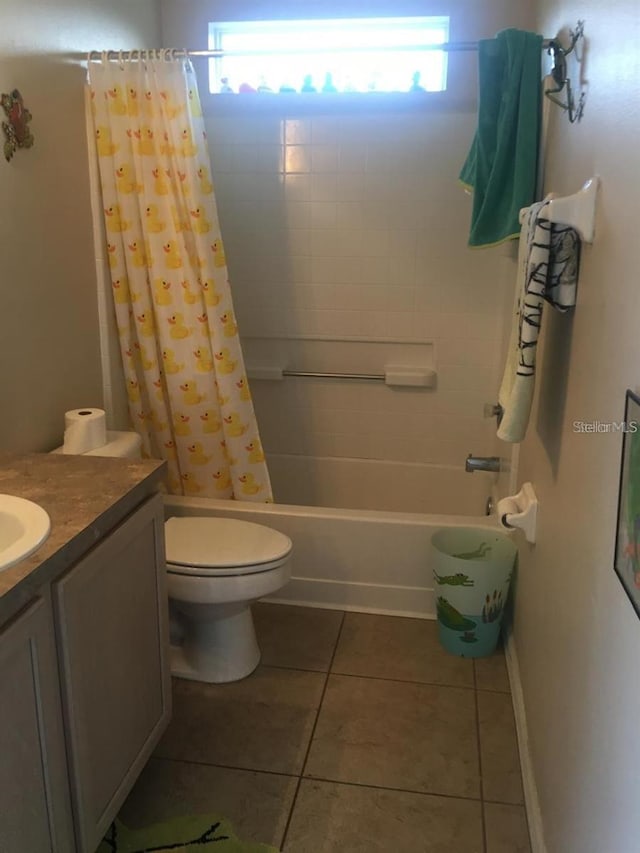 full bathroom with plenty of natural light, shower / tub combo, vanity, and tile patterned floors