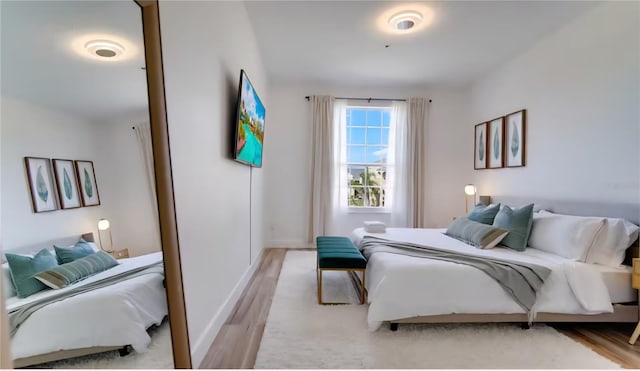 8103 Coconut Palm Way Unit 203, Kissimmee, FL 34747 - bedroom featuring wood finished floors and baseboards
