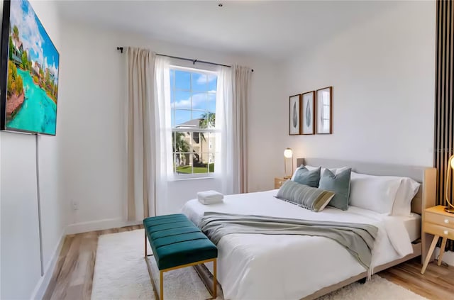 8103 Coconut Palm Way Unit 203, Kissimmee, FL 34747 - bedroom featuring wood finished floors and baseboards