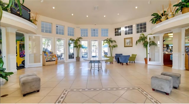 8103 Coconut Palm Way Unit 203, Kissimmee, FL 34747 - common area with a towering ceiling and recessed lighting