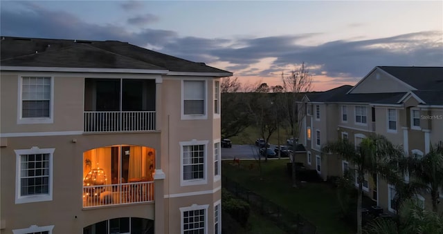 8103 Coconut Palm Way Unit 203, Kissimmee, FL 34747 - view of side of home featuring a balcony and stucco siding