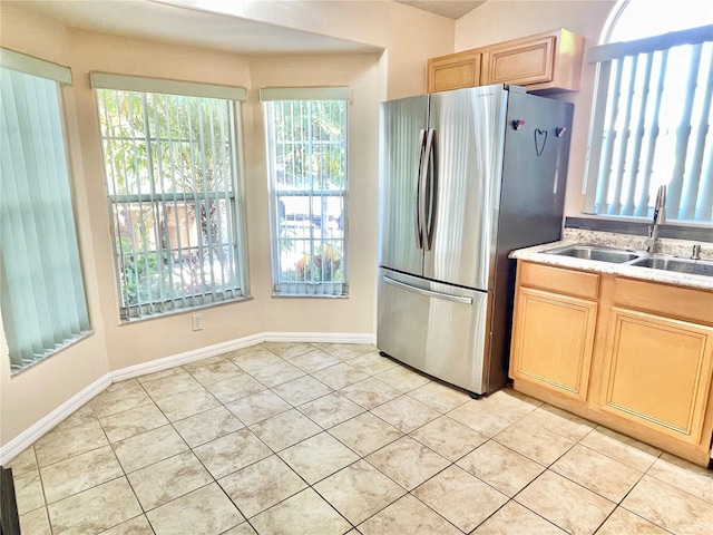 162 Seneca Point Trl, Kissimmee, FL 34746 - kitchen featuring freestanding refrigerator, light tile patterned flooring, and light brown cabinetry