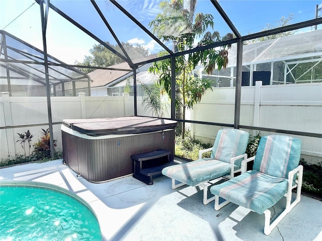 162 Seneca Point Trl, Kissimmee, FL 34746 - swimming pool featuring a hot tub, a fenced backyard, a patio, and glass enclosure