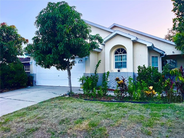162 Seneca Point Trl, Kissimmee, FL 34746 - view of front of home with driveway, stucco siding, and a garage
