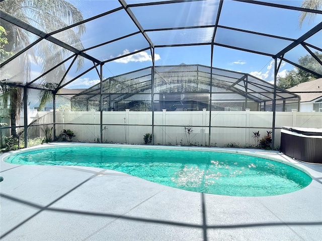 162 Seneca Point Trl, Kissimmee, FL 34746 - view of pool featuring a patio area, a fenced backyard, a lanai, and a hot tub