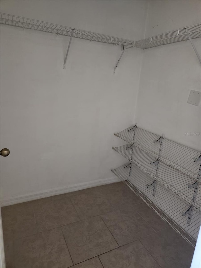 3502 Windy Walk Way Unit 2-208, Orlando, FL 32837 - spacious closet with tile patterned floors