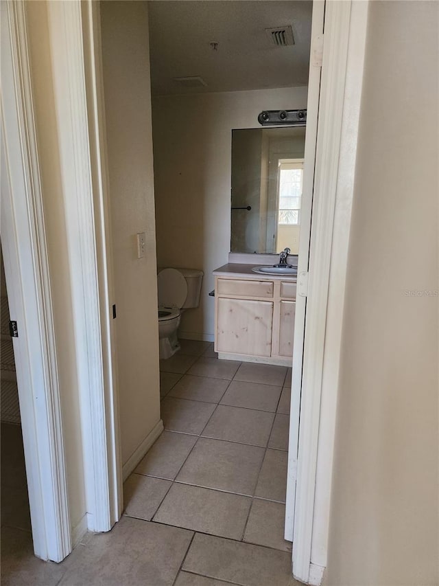 3502 Windy Walk Way Unit 2-208, Orlando, FL 32837 - bathroom with tile patterned flooring and vanity