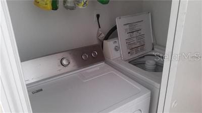 4160 Pershing Pointe Pl Unit 1, Orlando, FL 32822 - laundry area with washer and clothes dryer