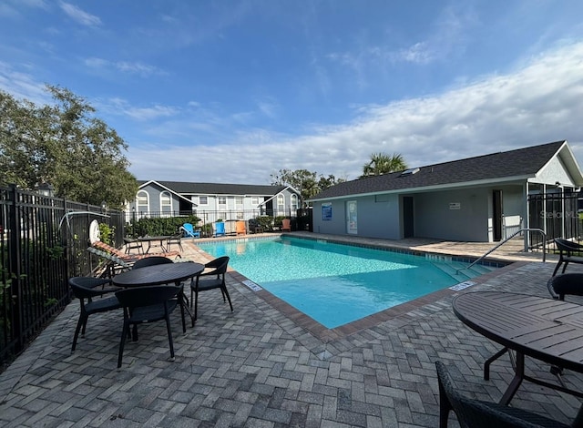 4160 Pershing Pointe Pl Unit 1, Orlando, FL 32822 - community pool featuring a patio