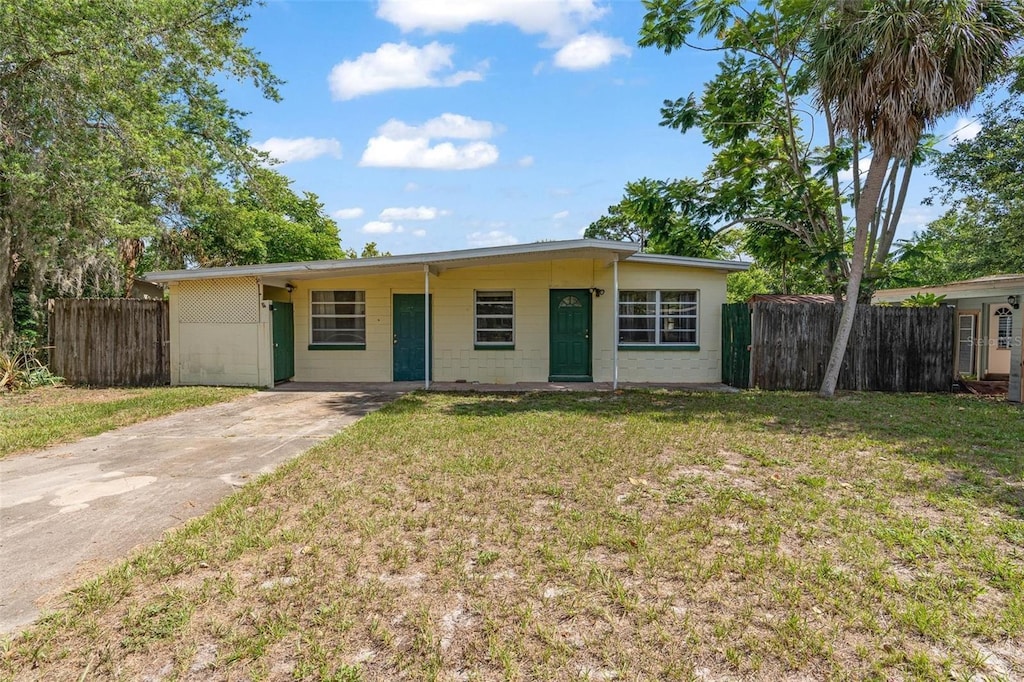 441 Kentia Rd, Casselberry, FL 32707 - ranch-style house featuring driveway and concrete block siding