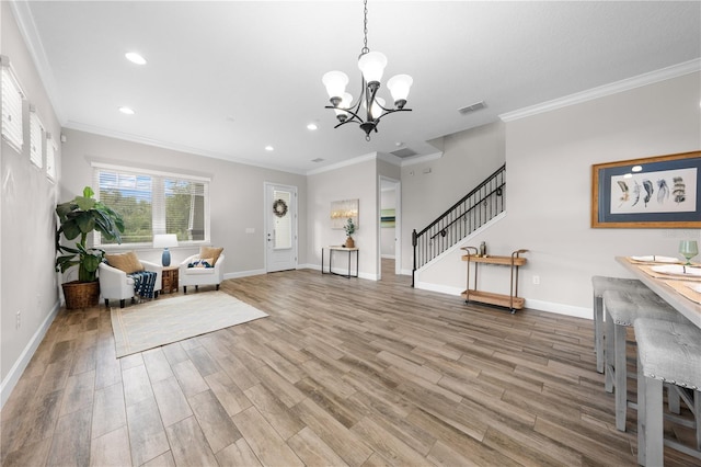 9121 Laureate Blvd, Orlando, FL 32827 - foyer featuring wood finished floors, a chandelier, stairway, crown molding, and recessed lighting
