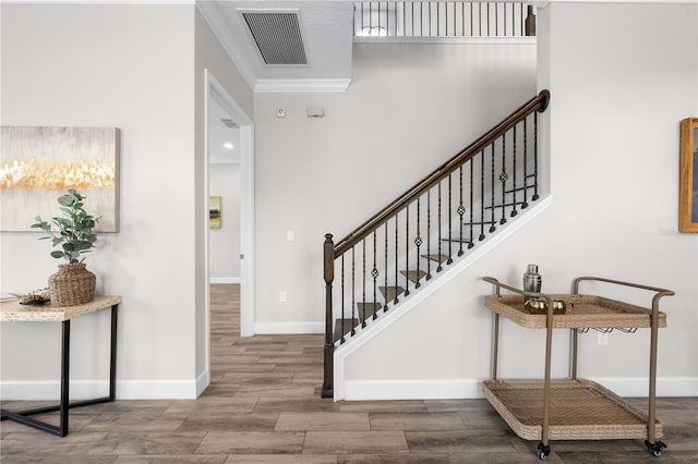 9121 Laureate Blvd, Orlando, FL 32827 - entryway with wood finished floors, ornamental molding, and stairs
