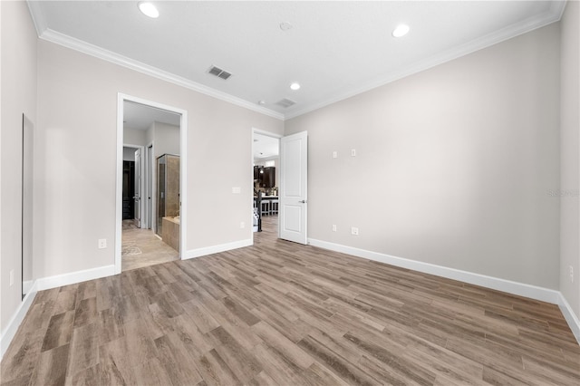 9121 Laureate Blvd, Orlando, FL 32827 - unfurnished bedroom featuring light wood-type flooring, recessed lighting, crown molding, and connected bathroom