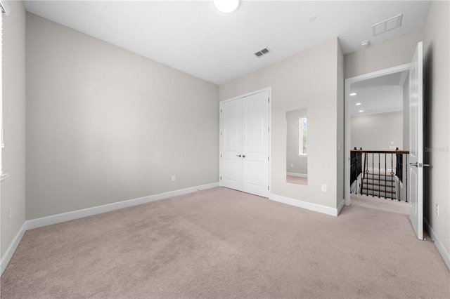 9121 Laureate Blvd, Orlando, FL 32827 - unfurnished bedroom with carpet flooring and a closet