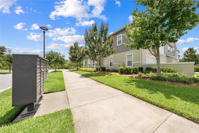 9121 Laureate Blvd, Orlando, FL 32827 - surrounding community with mail area and a lawn