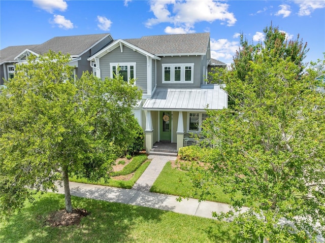 9121 Laureate Blvd, Orlando, FL 32827 - view of front of house featuring a porch, stucco siding, and roof with shingles