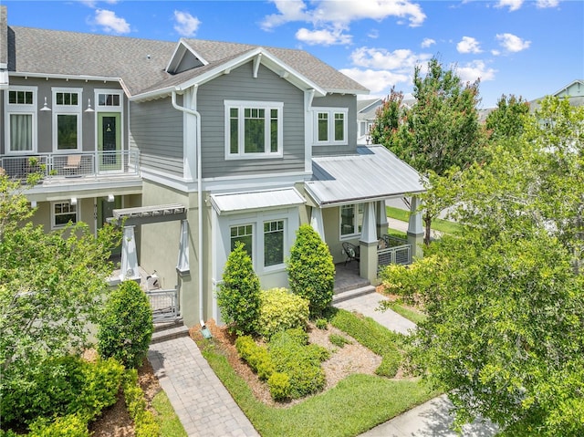 9121 Laureate Blvd, Orlando, FL 32827 - view of front of home with a porch, a shingled roof, and stucco siding