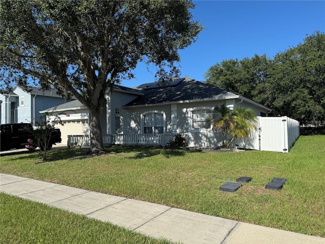 478 Acacia Tree Way, Kissimmee, FL 34758 - ranch-style home featuring solar panels and an attached garage