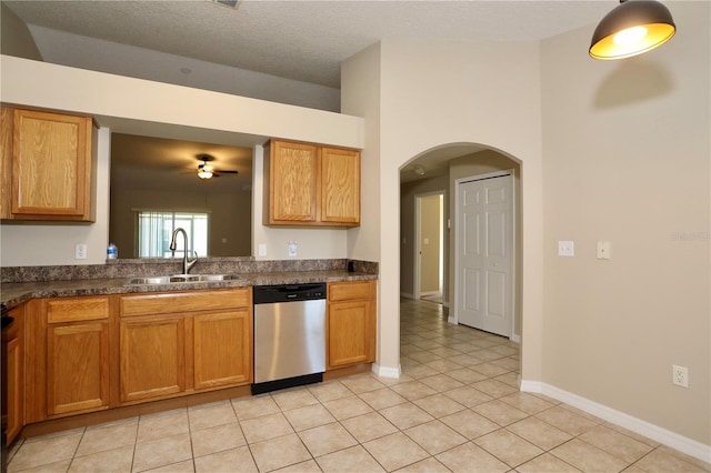 1749 Christina Lee Ln, Saint Cloud, FL 34769 - kitchen featuring dishwasher, ceiling fan, dark countertops, light tile patterned floors, and arched walkways