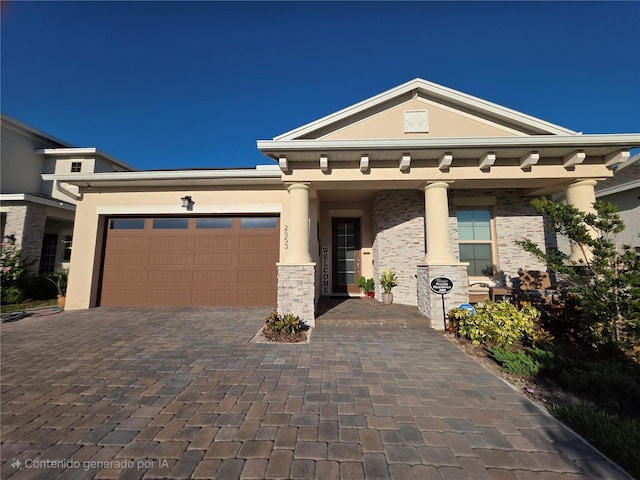 2853 Willowseed Ln, Saint Cloud, FL 34772 - view of front facade featuring decorative driveway, an attached garage, and stucco siding