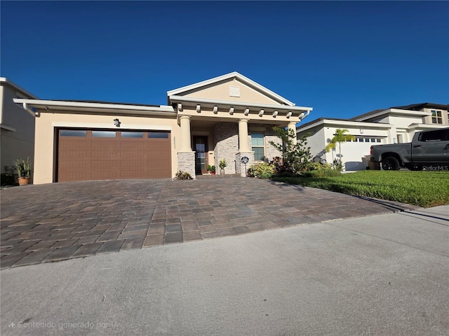 2853 Willowseed Ln, Saint Cloud, FL 34772 - view of front of house with an attached garage, decorative driveway, and stucco siding