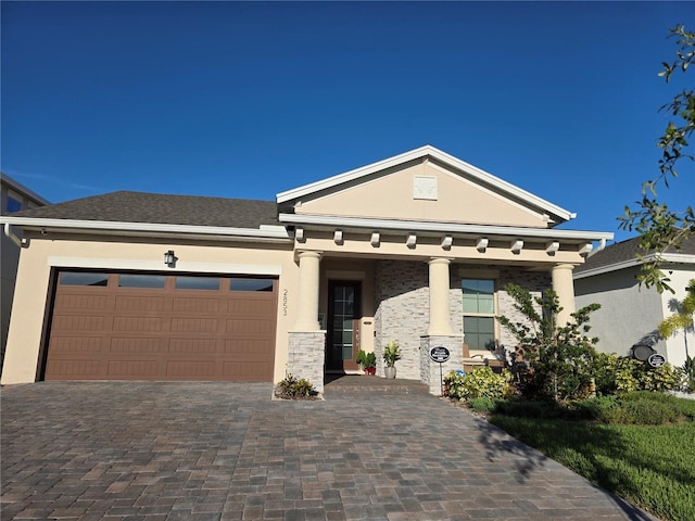 2853 Willowseed Ln, Saint Cloud, FL 34772 - view of front of property featuring decorative driveway, stucco siding, and an attached garage