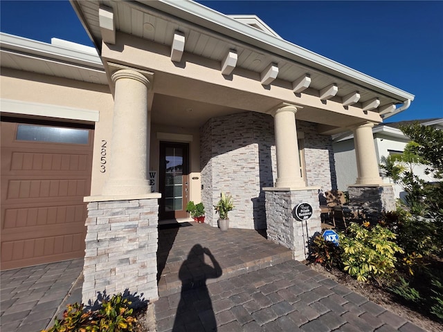 2853 Willowseed Ln, Saint Cloud, FL 34772 - view of exterior entry featuring a porch and stucco siding