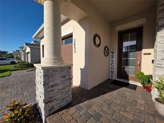 2853 Willowseed Ln, Saint Cloud, FL 34772 - view of exterior entry with stucco siding