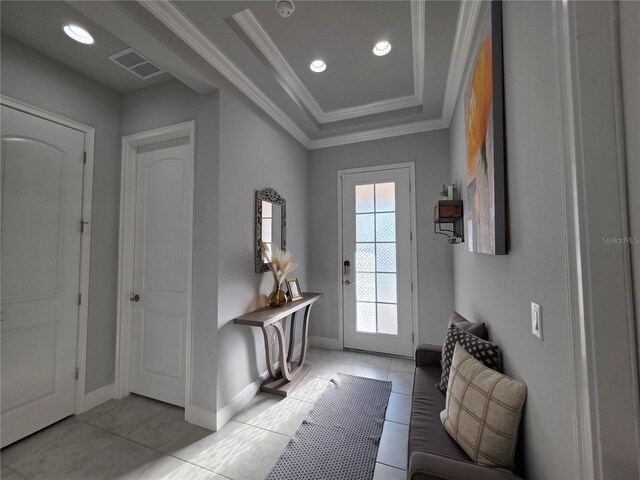 2853 Willowseed Ln, Saint Cloud, FL 34772 - entrance foyer with ornamental molding, light tile patterned floors, a raised ceiling, and recessed lighting