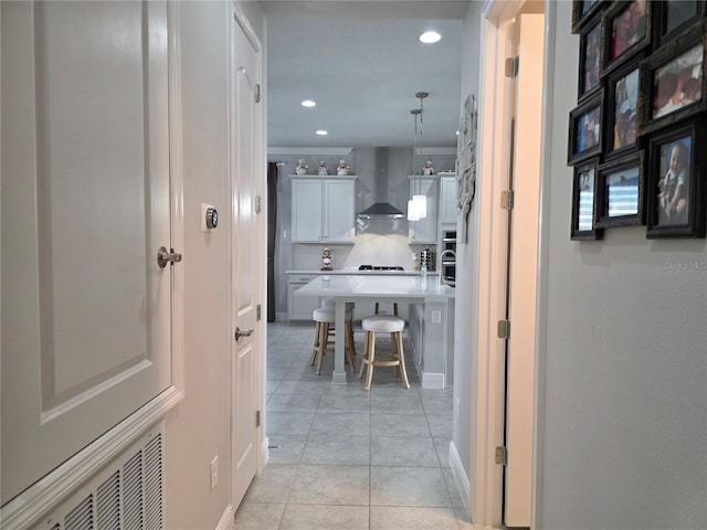 2853 Willowseed Ln, Saint Cloud, FL 34772 - corridor with light tile patterned flooring, recessed lighting, and crown molding