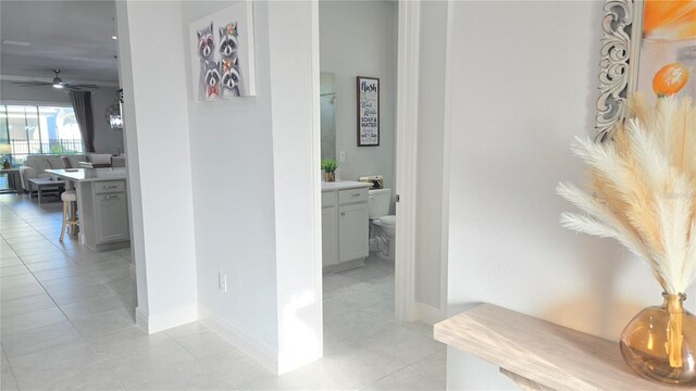 2853 Willowseed Ln, Saint Cloud, FL 34772 - corridor featuring light tile patterned floors and a desk