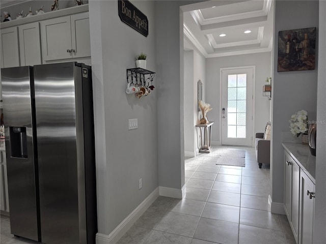 2853 Willowseed Ln, Saint Cloud, FL 34772 - kitchen featuring stainless steel fridge with ice dispenser, crown molding, light tile patterned flooring, a tray ceiling, and recessed lighting
