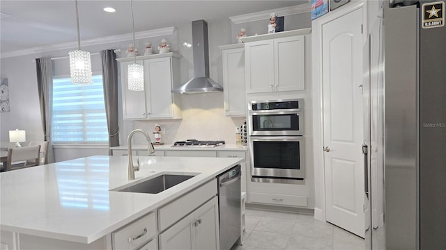 2853 Willowseed Ln, Saint Cloud, FL 34772 - kitchen featuring wall chimney exhaust hood, stainless steel appliances, crown molding, light countertops, and white cabinetry