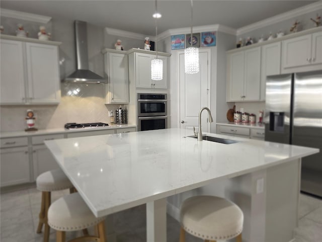 2853 Willowseed Ln, Saint Cloud, FL 34772 - kitchen featuring stainless steel appliances, wall chimney exhaust hood, ornamental molding, decorative backsplash, and a kitchen bar