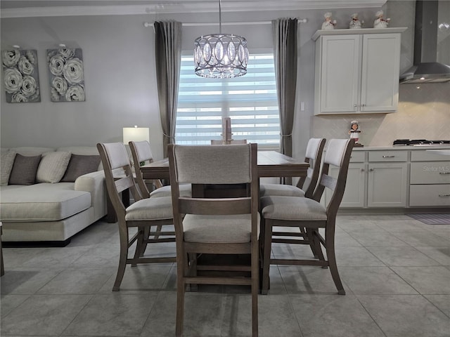 2853 Willowseed Ln, Saint Cloud, FL 34772 - dining area featuring a chandelier, light tile patterned floors, and crown molding