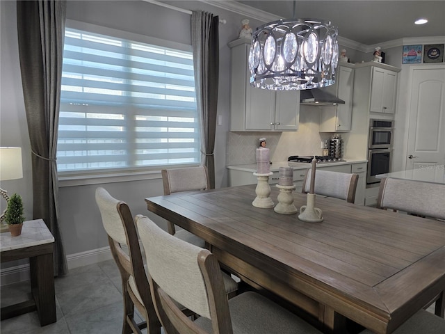 2853 Willowseed Ln, Saint Cloud, FL 34772 - dining area with plenty of natural light, ornamental molding, a chandelier, and light tile patterned floors