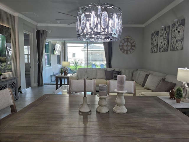 2853 Willowseed Ln, Saint Cloud, FL 34772 - dining room featuring crown molding, a chandelier, and tile patterned flooring