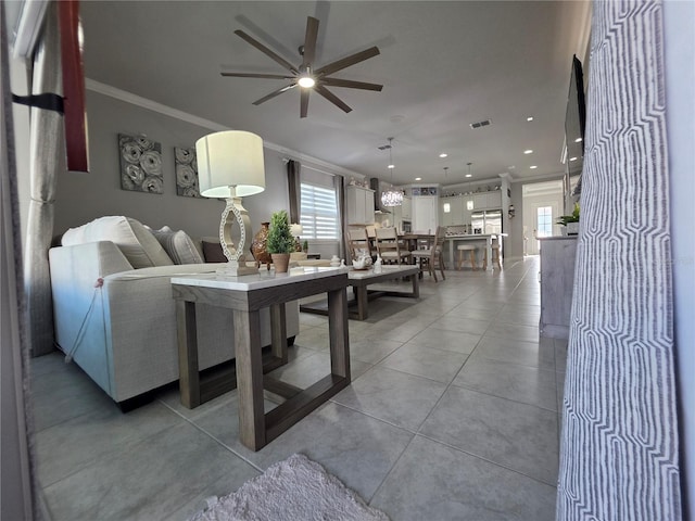 2853 Willowseed Ln, Saint Cloud, FL 34772 - living area featuring ornamental molding, ceiling fan, and recessed lighting