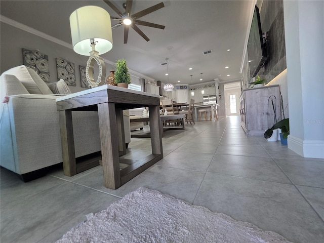 2853 Willowseed Ln, Saint Cloud, FL 34772 - living area featuring a ceiling fan, finished concrete flooring, recessed lighting, and ornamental molding