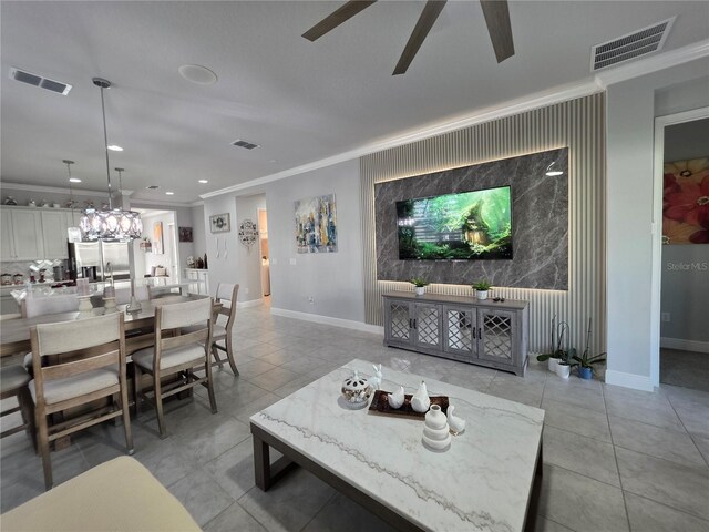 2853 Willowseed Ln, Saint Cloud, FL 34772 - living area with light tile patterned floors, a ceiling fan, crown molding, an accent wall, and recessed lighting