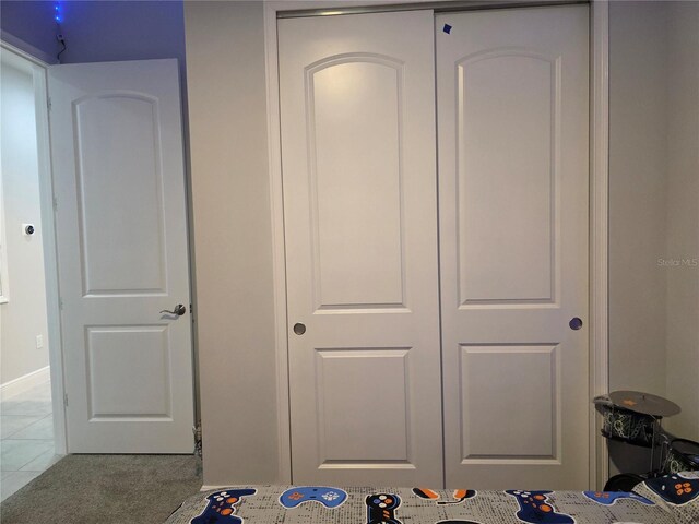 2853 Willowseed Ln, Saint Cloud, FL 34772 - bedroom with baseboards and tile patterned floors